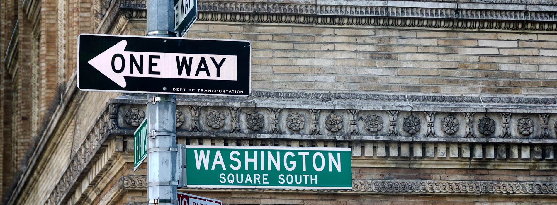 street sign with Washington Square Park and One Way on it 