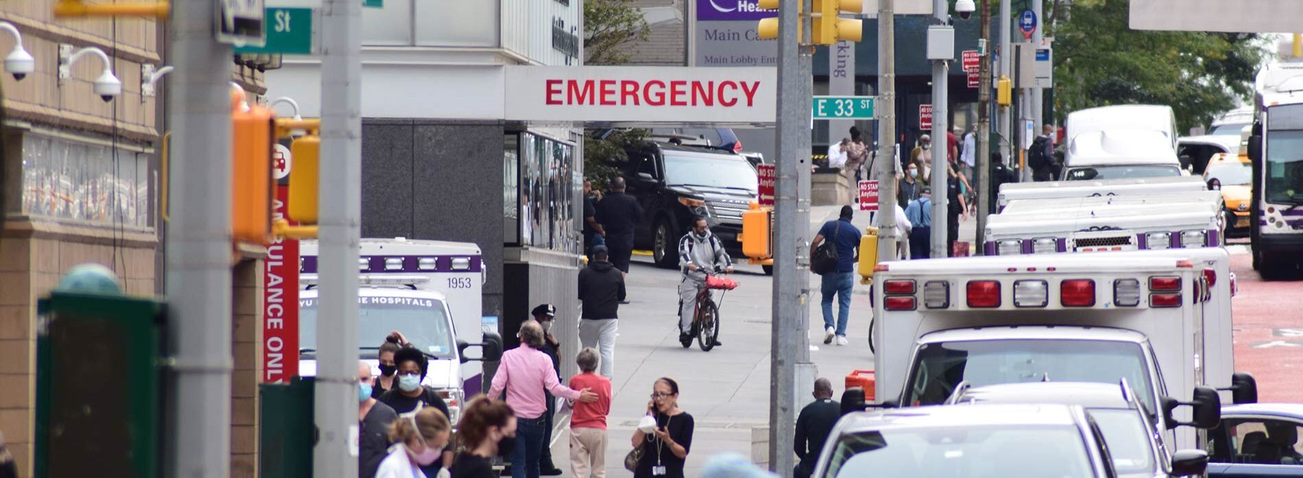 multiple-people-on-sidewalk-outside-NYU-hospital-in-NYC-at-E.-33rd-Street.